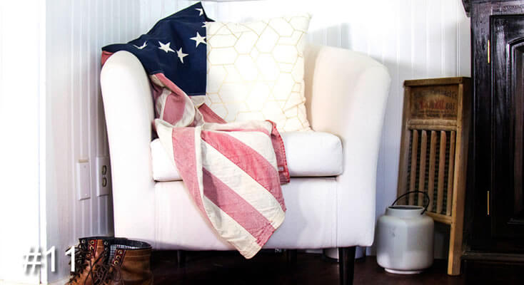Photo of a comfy armchair with cushion and US flag