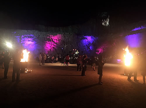 Photo of the people dancing in coloured lights at the 2017 Forum Dinner venue - The Old Quarry, Alice Springs