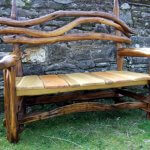 Photo of a garden bench chair made from natural tree branches