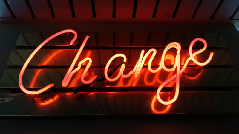 Photo of a neon sign spelling the word 'Change'