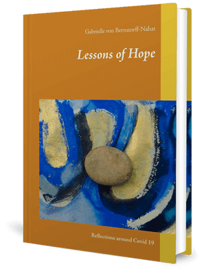 Cover of a book with an abstract painting and a stone resting on it