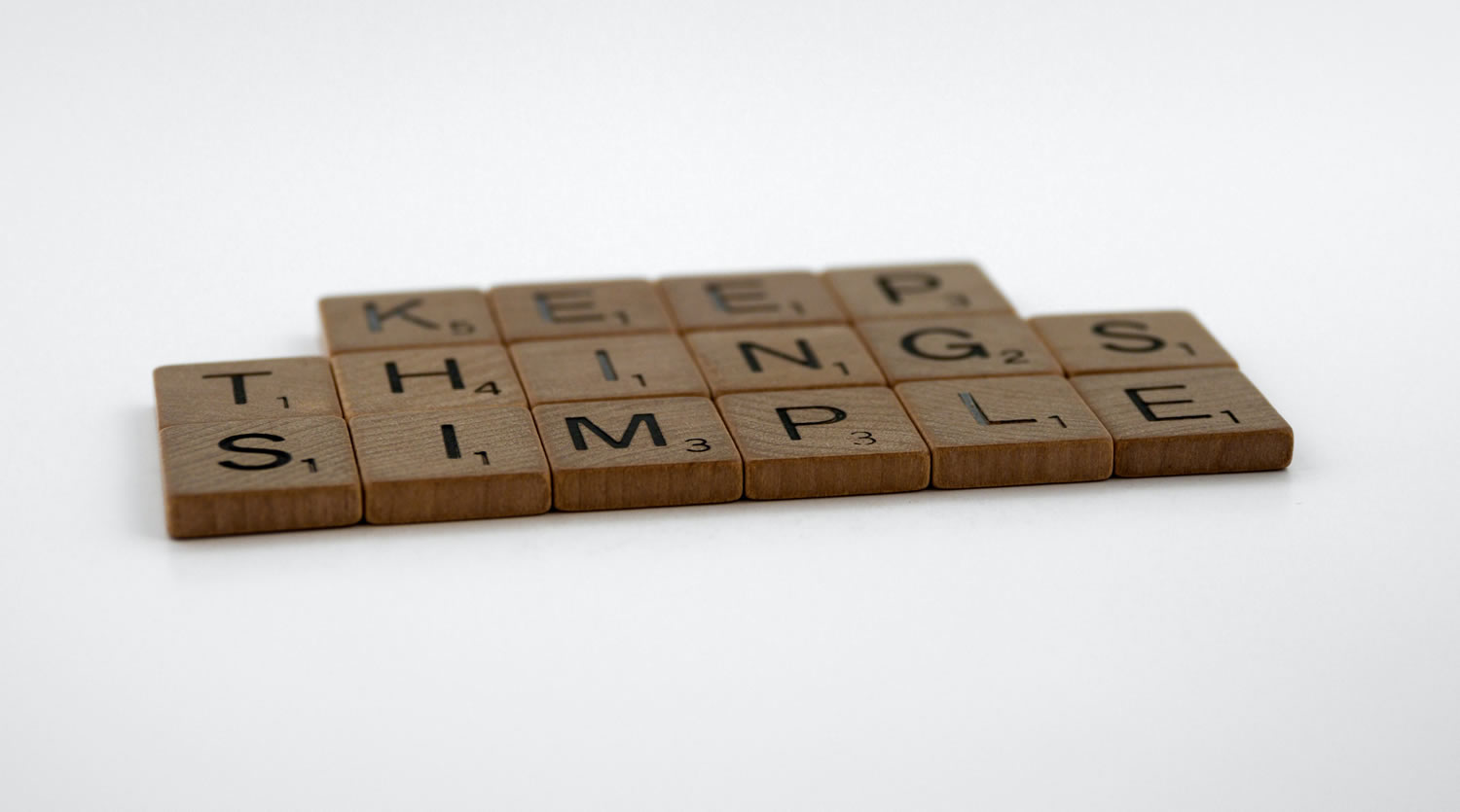 Photo of Scrabble tiles that read, 'KEEP THINGS SIMPLE'.